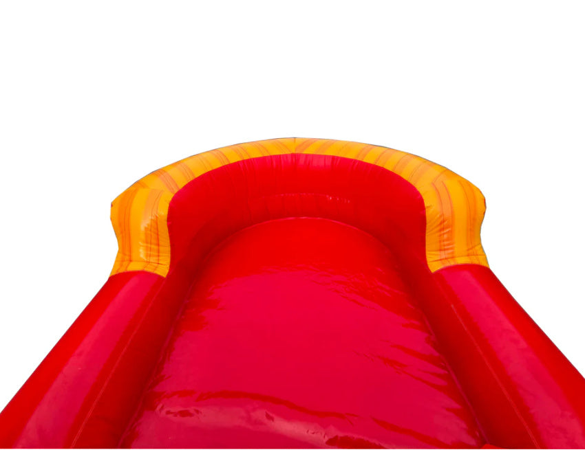 Red inflatable slide with yellow top pool area