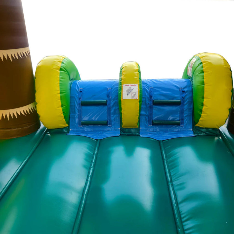 Inflatable water slide with green base and blue center, surrounded by yellow and green cylindrical obstacles.