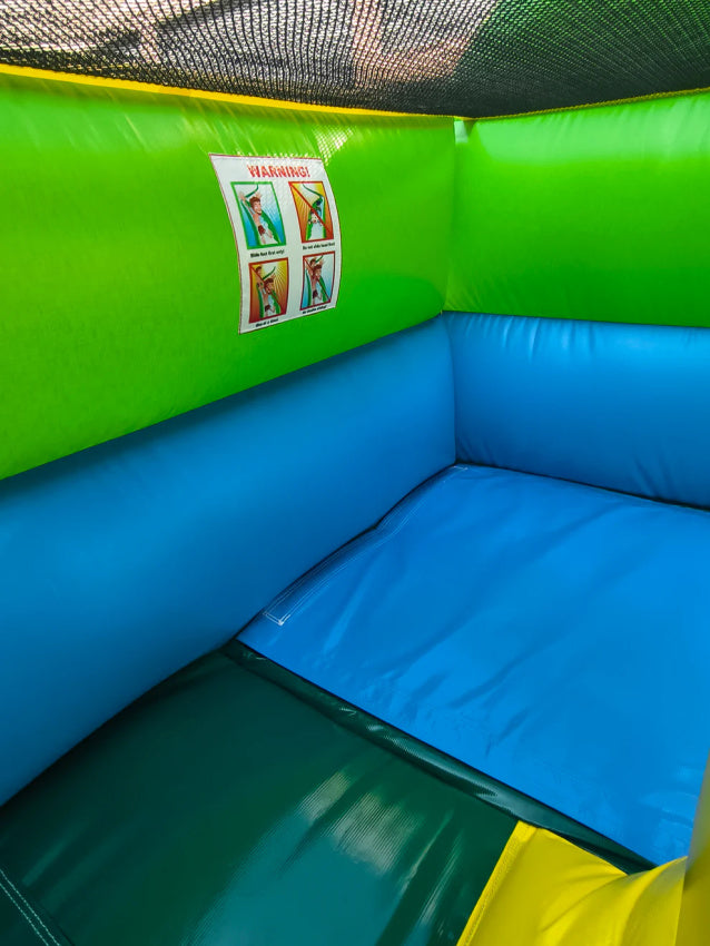 Corner of a colorful inflatable play area with green, blue, and yellow colors.