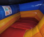Colorful inflatable bounce house with warning labels 