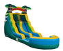 Colorful inflatable water slide with palm tree decorations on a white background