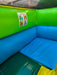 Corner of a colorful inflatable play area with green, blue, and yellow colors.